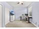 A comfortably carpeted spare bedroom features a ceiling fan and a desk at 3632 Gretchen Dr, Ocoee, FL 34761