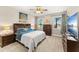 This bedroom boasts a ceiling fan, large windows, and stylish decor, creating a relaxing retreat at 3632 Gretchen Dr, Ocoee, FL 34761