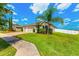 A well-manicured front yard leads to a single-story home with a two-car garage at 3632 Gretchen Dr, Ocoee, FL 34761