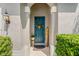Inviting front entrance with a blue door, decorative wreath, and welcoming decor at 3632 Gretchen Dr, Ocoee, FL 34761