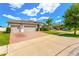 Charming home with a two-car garage and a well-manicured brick driveway at 3632 Gretchen Dr, Ocoee, FL 34761