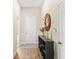 Charming hallway with wood floors, a decorative mirror, storage, and a welcoming entrance at 3632 Gretchen Dr, Ocoee, FL 34761
