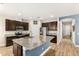 Spacious kitchen with stainless steel appliances, granite countertops, and a large center island at 3632 Gretchen Dr, Ocoee, FL 34761