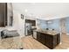 Open kitchen with stainless steel appliances, granite countertops, and a large island with seating at 3632 Gretchen Dr, Ocoee, FL 34761