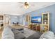 Cozy living room with comfortable sectional, stylish ceiling fan, and view of the dining and kitchen areas at 3632 Gretchen Dr, Ocoee, FL 34761