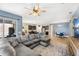 Open-concept living area with plenty of room, seamlessly connecting the living room, kitchen, and dining areas at 3632 Gretchen Dr, Ocoee, FL 34761