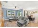 Comfortable sectional sofa with lots of room in a modern living room leading to the dining area and kitchen at 3632 Gretchen Dr, Ocoee, FL 34761