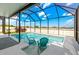 A screened-in pool area features in-pool seating under an expansive screened enclosure at 3632 Gretchen Dr, Ocoee, FL 34761