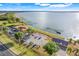 Aerial view of a lakeside property with a restaurant, parking, and stunning water views at 3640 Crump Rd, Winter Haven, FL 33881