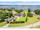Aerial view of an estate home with meticulous landscaping and lake views at 3640 Crump Rd, Winter Haven, FL 33881