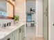 Light green bathroom with a marble countertop and a view to the bedroom at 3640 Crump Rd, Winter Haven, FL 33881