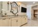 A stylish bathroom vanity features granite countertops, stylish mirrors, and shaker-style cabinets at 3640 Crump Rd, Winter Haven, FL 33881