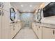 A luxury bathroom suite boasts dual vanities, a walk-in shower, and neutral color palette at 3640 Crump Rd, Winter Haven, FL 33881
