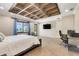 A large main bedroom is complemented by a unique ceiling design, waterfront view, and dedicated work space at 3640 Crump Rd, Winter Haven, FL 33881