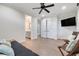 Bedroom showing a door to the bathroom, a closet, wood-look floors, and a ceiling fan at 3640 Crump Rd, Winter Haven, FL 33881