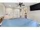 Bedroom view showing a bed, closet, door to the bathroom and a ceiling fan at 3640 Crump Rd, Winter Haven, FL 33881