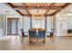 Cozy dining area with a wood table, leather chairs, and elegant lighting adjacent to the kitchen at 3640 Crump Rd, Winter Haven, FL 33881