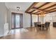 Inviting dining area with a decorative chandelier, a large wood table, and an ornate front door at 3640 Crump Rd, Winter Haven, FL 33881