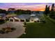 Stunning lakefront home with lush landscaping, circular driveway, and a three-car garage at 3640 Crump Rd, Winter Haven, FL 33881