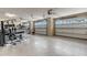 Spacious garage equipped with multiple car doors, jet ski, and exercise machine at 3640 Crump Rd, Winter Haven, FL 33881