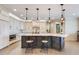 Open kitchen featuring white countertops, stainless appliances, a large island, and pendant lighting at 3640 Crump Rd, Winter Haven, FL 33881