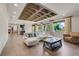 Spacious living room with coffered ceilings, hardwood floors, and large windows offering plenty of natural light at 3640 Crump Rd, Winter Haven, FL 33881