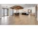 Expansive living space with wood floors, an ornate door, a modern kitchen, and a dining area at 3640 Crump Rd, Winter Haven, FL 33881