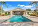 Outdoor pool with fountain feature and covered patio space, perfect for entertaining or enjoying the backyard at 3640 Crump Rd, Winter Haven, FL 33881