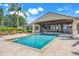 Relax by this large rectangular pool with a covered patio area, creating the perfect setting for relaxing and entertaining at 3640 Crump Rd, Winter Haven, FL 33881