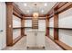 This generously sized walk-in closet features a central island and custom shelving at 3640 Crump Rd, Winter Haven, FL 33881