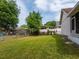 Large backyard with grass and partial fencing at 3830 Spring Breeze Dr, Orlando, FL 32829