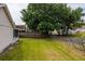Fenced backyard with grass and trees at 3830 Spring Breeze Dr, Orlando, FL 32829