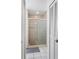 Bathroom with a tiled shower and glass door at 3830 Spring Breeze Dr, Orlando, FL 32829