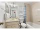 Bathroom with a tub, toilet, and sink at 3830 Spring Breeze Dr, Orlando, FL 32829
