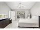 Bright bedroom with a ceiling fan, tile flooring, and access to the outdoor patio at 3830 Spring Breeze Dr, Orlando, FL 32829