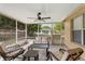 Screened patio with outdoor seating and view of the backyard at 3830 Spring Breeze Dr, Orlando, FL 32829