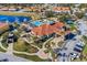 Aerial view featuring the clubhouse, community pool, nearby pond and playground in a beautiful neighborhood at 4569 Cabello Loop, Kissimmee, FL 34746
