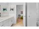 Bathroom with a modern vanity, framed artwork, and view into the next room at 4569 Cabello Loop, Kissimmee, FL 34746