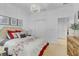 Well-lit bedroom featuring a comfortable bed, classic decor, and elegant lighting at 4569 Cabello Loop, Kissimmee, FL 34746