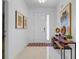 Inviting entryway with white walls, marble floors, stylish decor, and a bright front door at 4569 Cabello Loop, Kissimmee, FL 34746