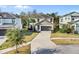 A two-story home has a driveway, landscaping, and a two-car garage at 4569 Cabello Loop, Kissimmee, FL 34746