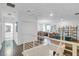 Open-concept hallway with views into the living area, chandelier, and updated staircase at 4569 Cabello Loop, Kissimmee, FL 34746