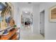 Bright hallway with marble floors, artful decor, and recessed lighting leads to the living areas at 4569 Cabello Loop, Kissimmee, FL 34746