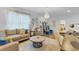 Cozy living room with comfortable seating, stylish decor, and a decorative chandelier at 4569 Cabello Loop, Kissimmee, FL 34746