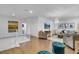 Open-concept living area with hardwood floors, a chandelier, and a neutral color palette at 4569 Cabello Loop, Kissimmee, FL 34746