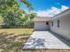 A backyard featuring a newly poured concrete patio, ideal for outdoor dining and entertaining, with private surroundings at 4887 Seminole Ave, Winter Park, FL 32792