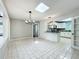 Bright dining room with view of the kitchen, featuring unique tile flooring at 4887 Seminole Ave, Winter Park, FL 32792