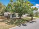 Cozy home featuring a mature shade tree and a fenced yard at 4887 Seminole Ave, Winter Park, FL 32792