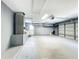 Spacious garage with laundry area, storage shelves, and overhead lighting at 4887 Seminole Ave, Winter Park, FL 32792