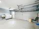 Clean garage with laundry hookups, sink, storage shelves, and painted walls at 4887 Seminole Ave, Winter Park, FL 32792